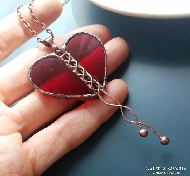 Heart-shaped red glass pendant made of translucent glass