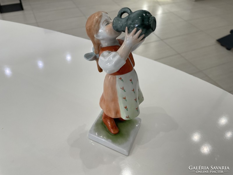 Porcelain figure of a girl drinking from a Herend mug