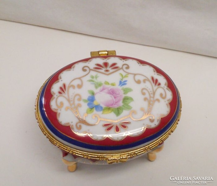 A jeweled bowl made of porcelain on pink oval legs