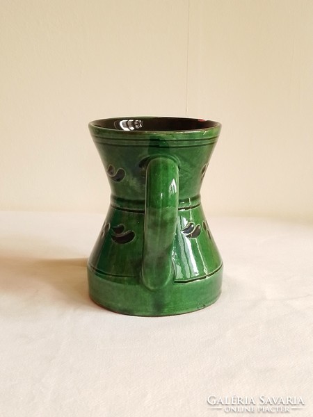 Old green glazed ceramic pitcher, large mug, folk pattern