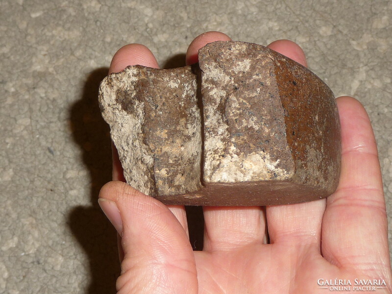 Fragment of an old stone ax An original polished stone ax from the Neolithic or Bronze Age