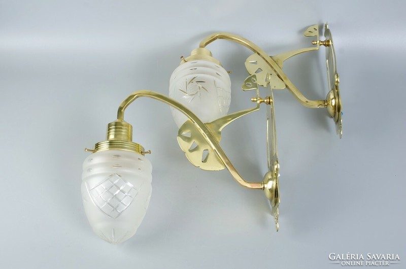 A pair of Art Nouveau wall arm lamps
