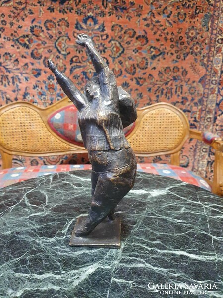Stretching, slightly chubby female bronze statue. It has no signature. With a very nice cast. 30cm high.