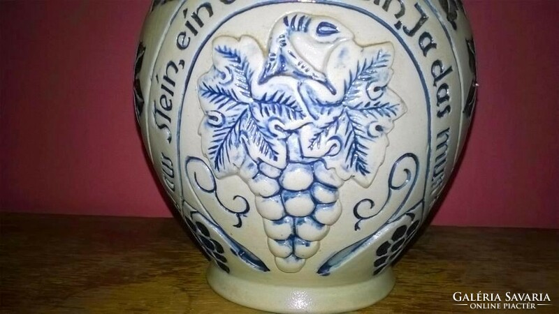 Embossed, ceramic wine jar