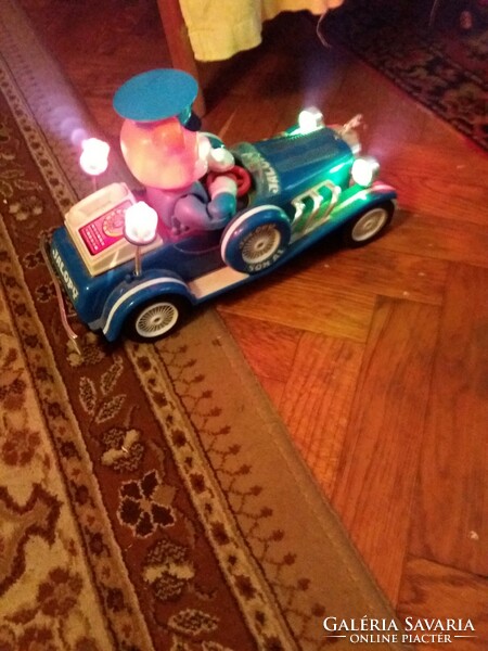 Antique jallopy toy car with battery-powered vinyl that works beautifully and makes a sound, according to the pictures