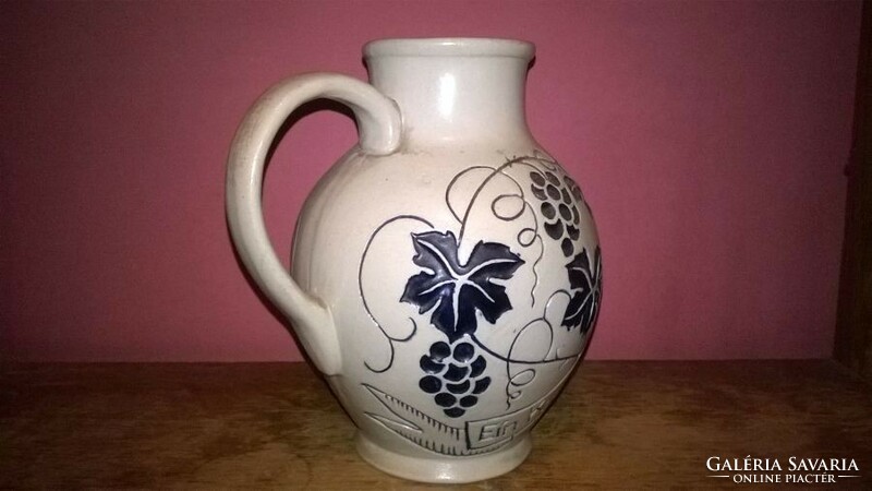 Embossed, ceramic wine jar