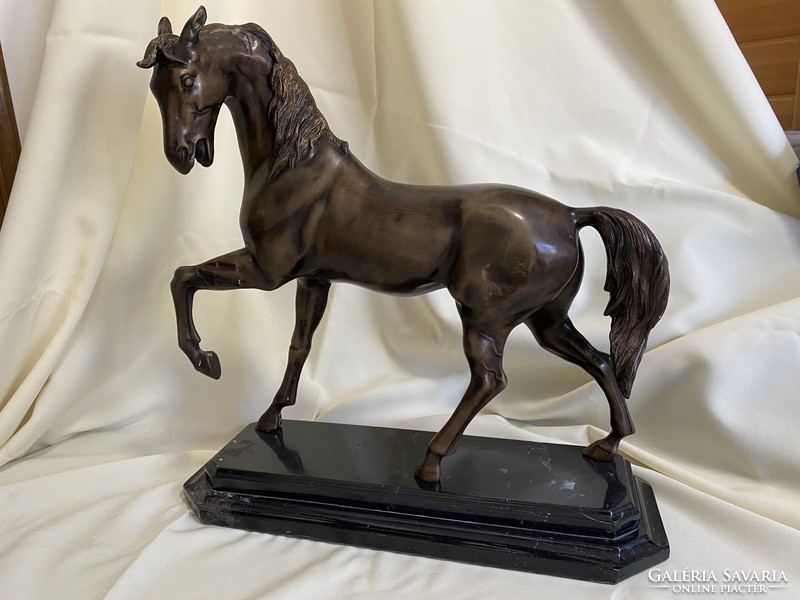 Bronze horse statue on a marble base