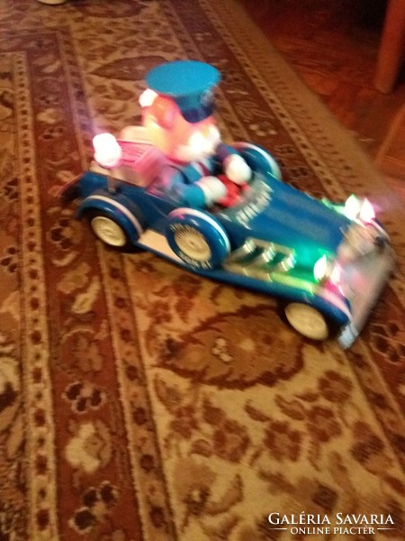 Antique jallopy toy car with battery-powered vinyl that works beautifully and makes a sound, according to the pictures