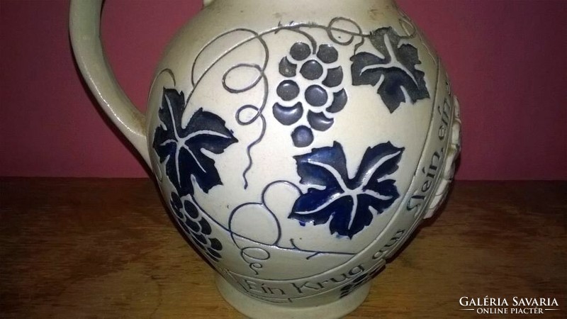 Embossed, ceramic wine jar