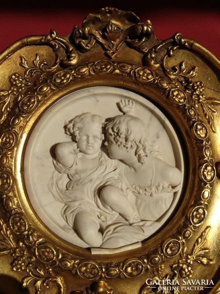 A pair of brothers on an antique wall decoration with marble inlays,,gilded,carving in a wooden frame,,35x35 cm,,