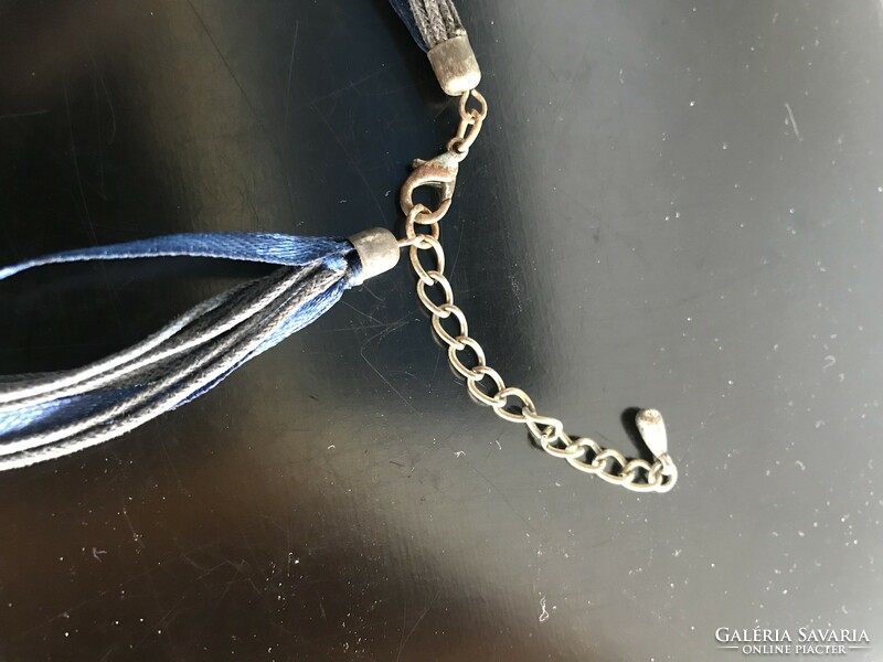 Decorative blue necklace with large mesh on leather thread (baked)