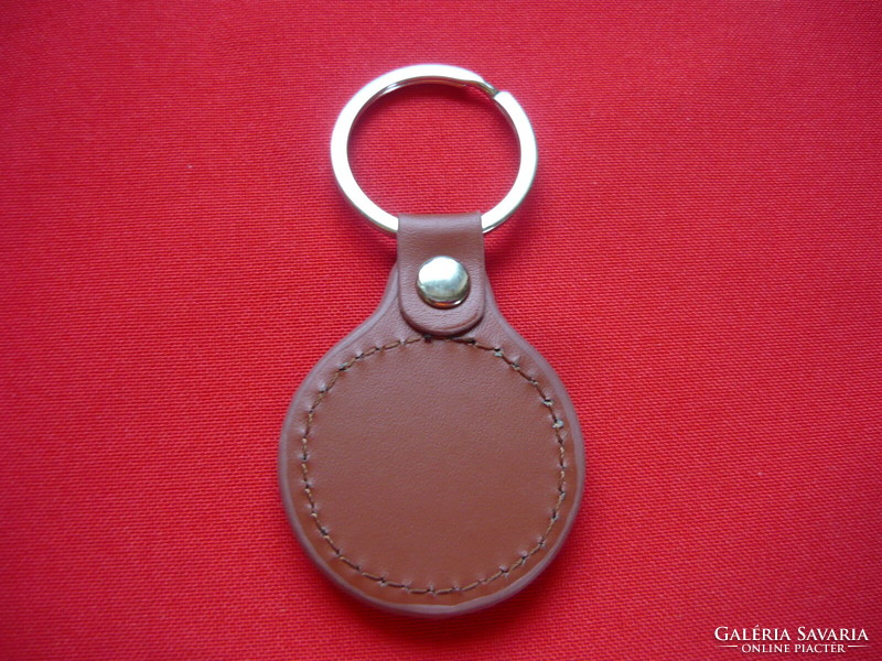 Tiburon metal key ring on a leather base
