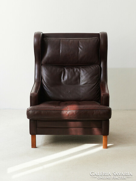 Danish midcentury armchair with leather and rosewood handles