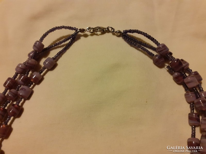 Purple necklace made of three rows of Murano glass beads
