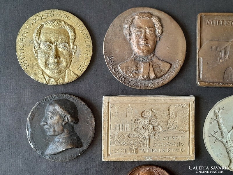 7 cast medals, plaques, designs, plaster samples
