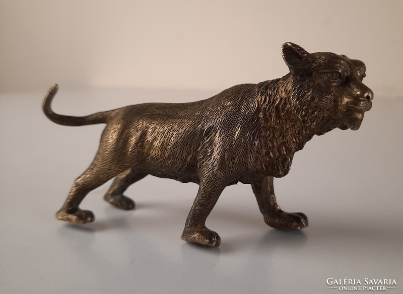 Antique bronze small lion statue