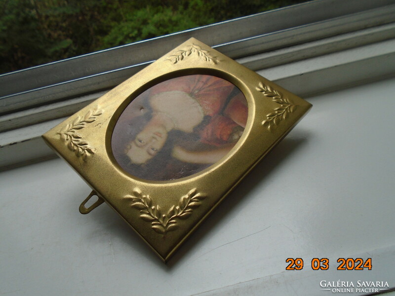 Gilded embossed copper frame with a portrait of an antique Venetian aristocratic lady