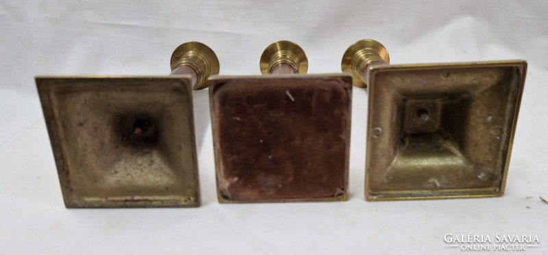 Old copper candle holders, with wooden stems, sold together.