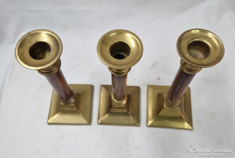 Old copper candle holders, with wooden stems, sold together.