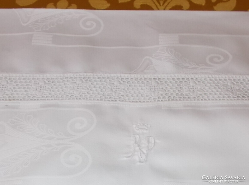 Crowned, monogrammed, azure damask pillowcase.