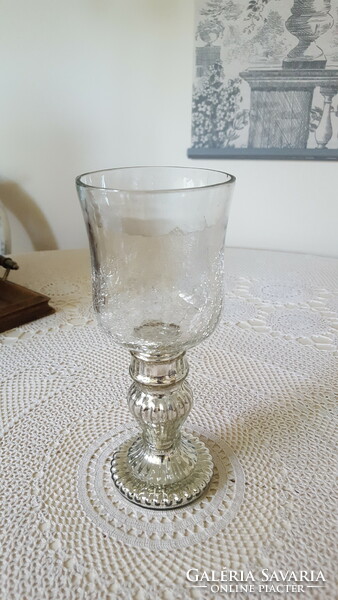 Glass candle holder and candle holder with a fluted base