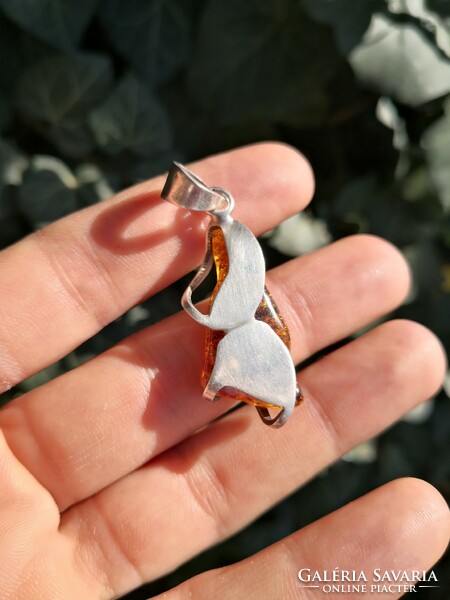 Beautiful silver pendant with real amber stones