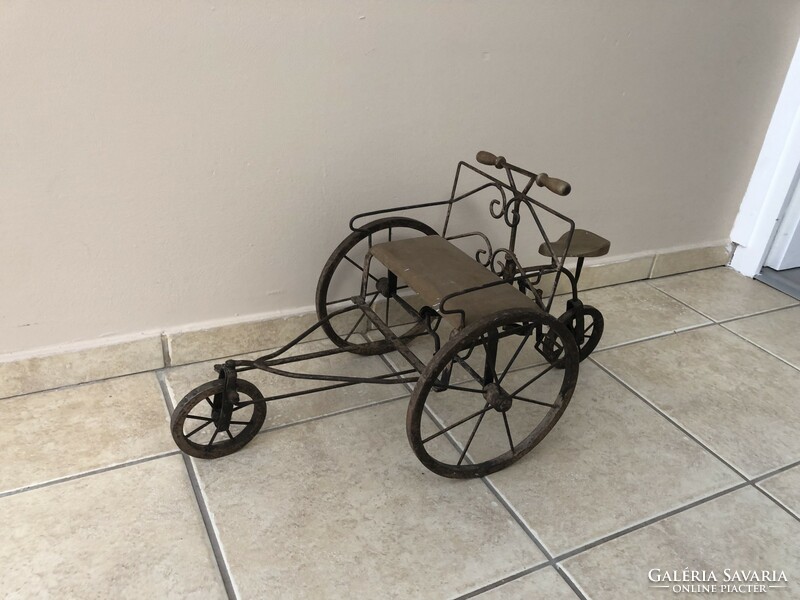 Old miniature tricycle made of iron