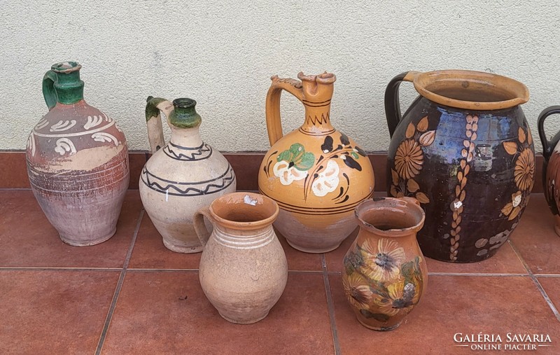Ceramic mugs with ears and drinking jugs are sold together