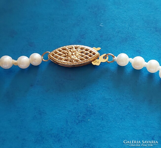 Real pearl necklace with 10k gold jewelry clasp, knotted string, growing pearls