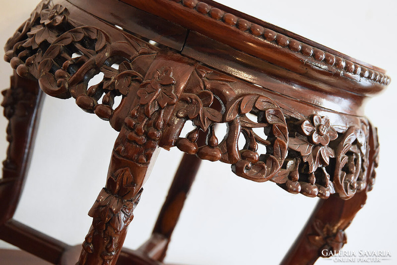 Chinese circular richly carved side table, glass top, 19th century. It's over