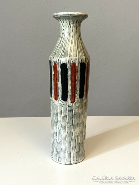 Illés retro ceramic vase on a white background with a striped pattern with a small lack of glaze at the bottom