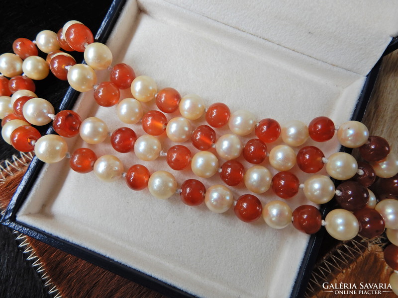 Old long string of true pearls with carnelian and silver clasp