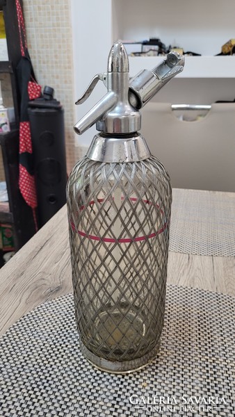 Old wire mesh soda bottle.