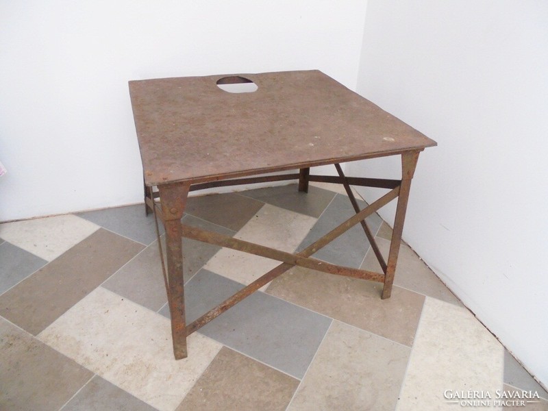 Antique old riveted iron table stand