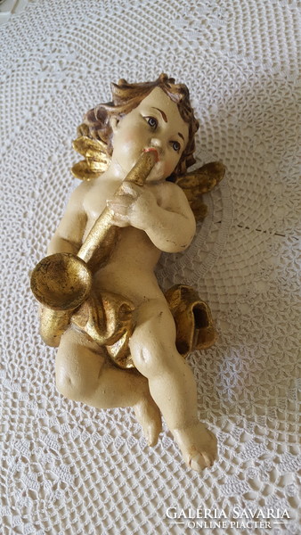 Old carved and painted wooden musical angel figure