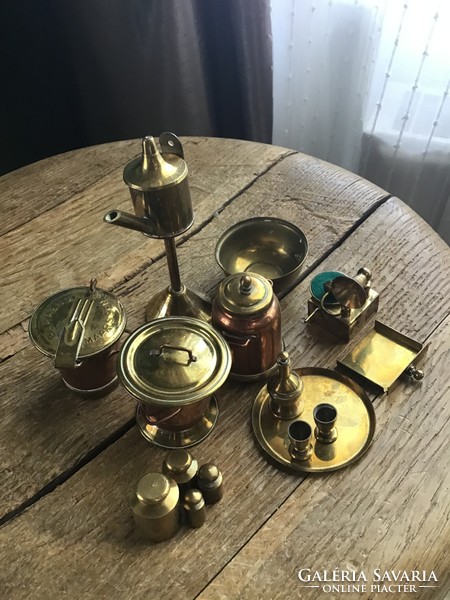 Old miniature yellow and red copper vessels in one