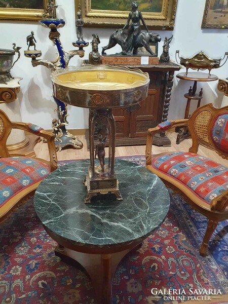 Original Art Nouveau table with its original glass insert. A particularly beautiful piece. 52cm high.