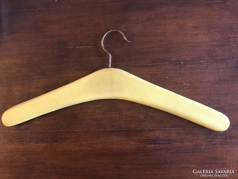 Retro clothes hanger. Shoulder wood. With yellow skin.