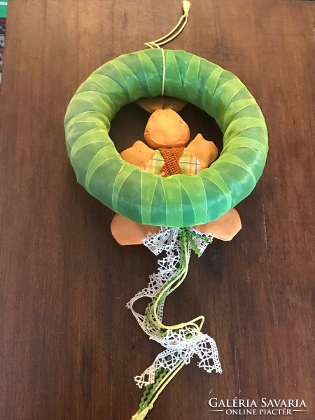 Bunny door knocker, wreath. Green silk base. Size: 25 cm with lace decoration.