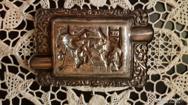 A life-size copper ashtray with a village scene in a patina condition with a beautiful engraving has been sold.