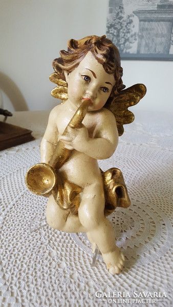 Old carved and painted wooden musical angel figure