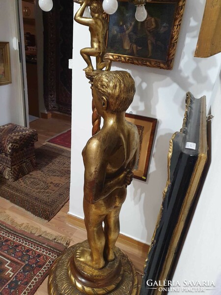 190 cm high 2 man-shaped standing lamp made of wood. 13 Combustible. Very nicely carved and gilded.
