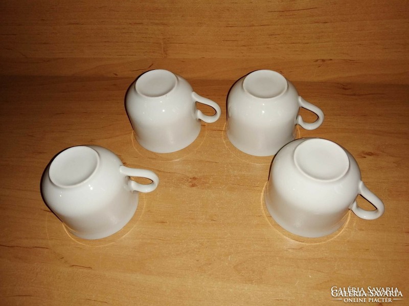 4 white porcelain coffee cups together (5/k)