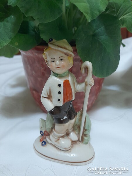 Hand painted porcelain figure.