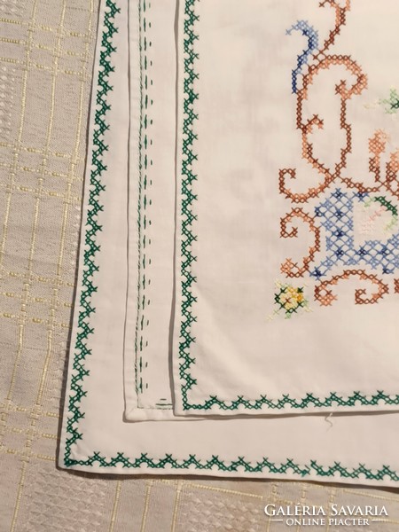 Linen tablecloth with a cross stitch pattern