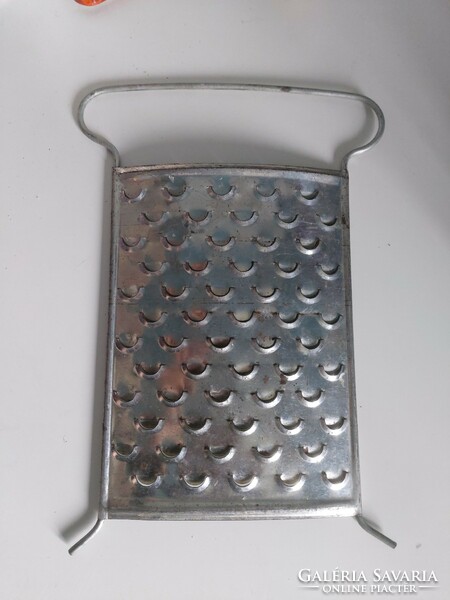 A beautiful and useful object, a file with a larger hole in a fish scale pattern