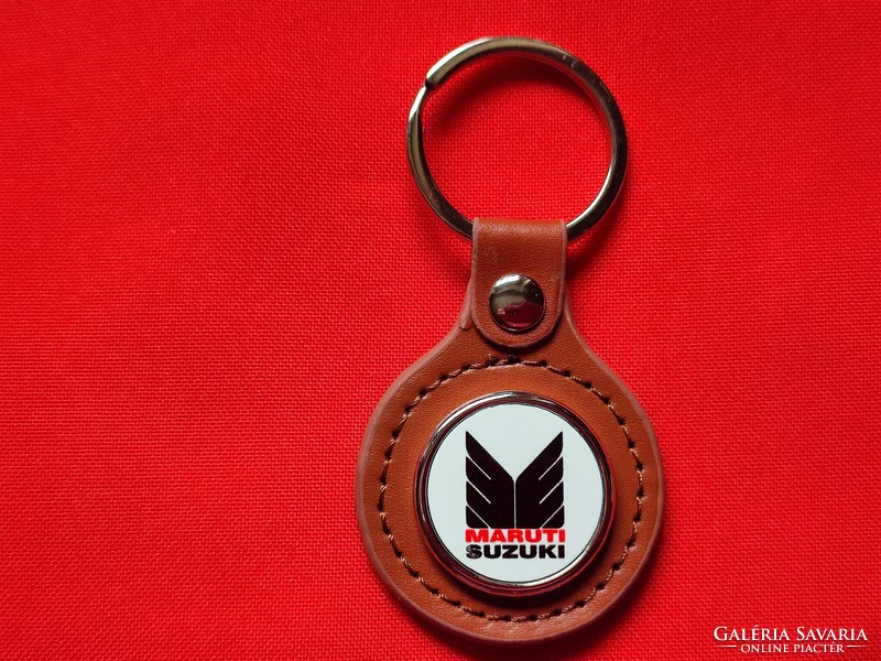 Suzuki Maruti metal key ring on a leather base