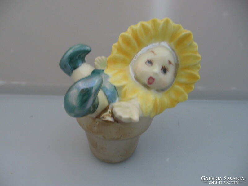 Sunflower porcelain figurine with baby face