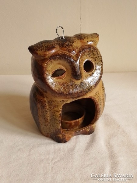 Old glazed ceramic candle holder, candle holder, in the shape of an owl figure, mood lighting