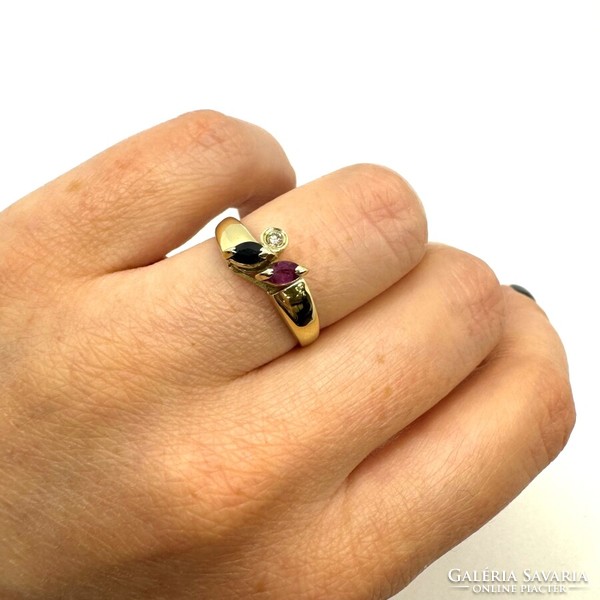 Yellow gold ring with diamonds, rubies and blue sapphires